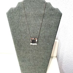 Silver pendant and necklace, designer signature at the back.